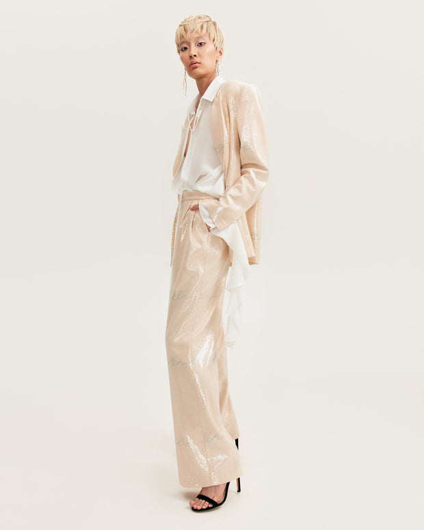 Sparkling beige trousers with Milla's signature, Xo Xo