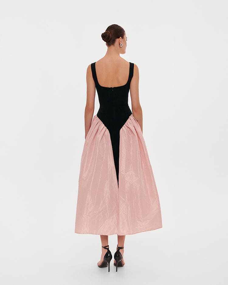Black corset dress on straps with a glossy pink midi skirt