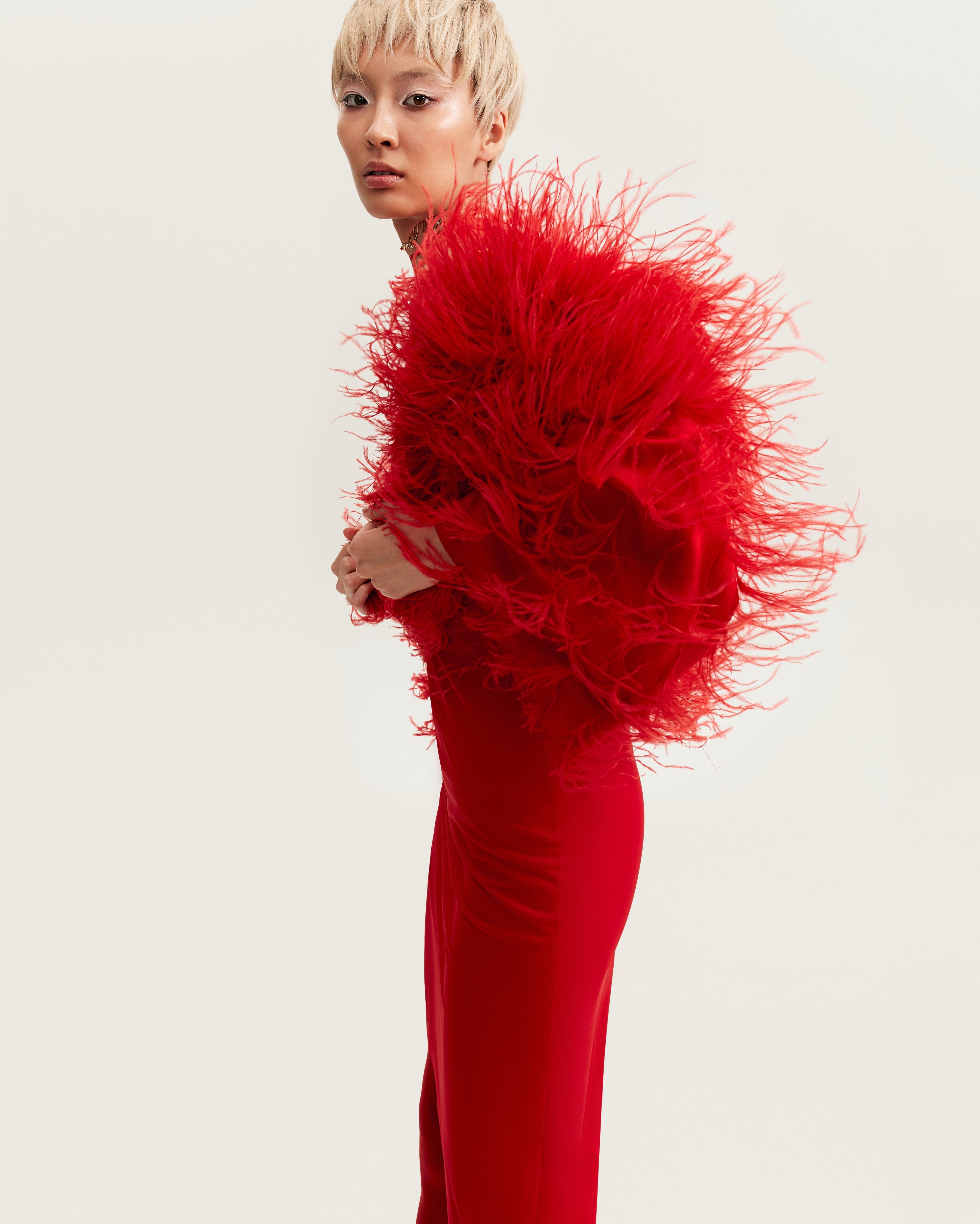 Bizarre red feather-trimmed coat, Xo Xo