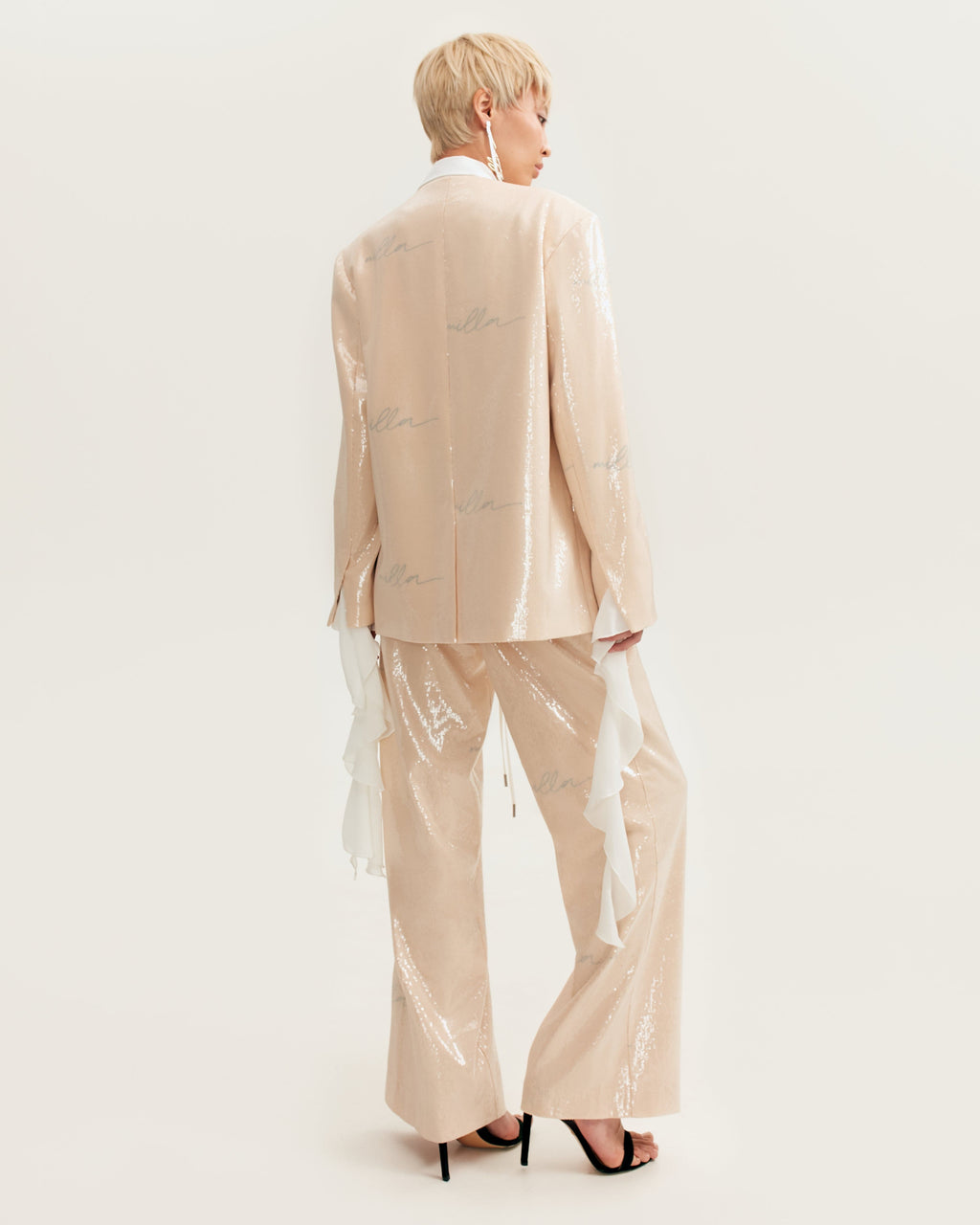 Sparkling beige trousers with Milla's signature, Xo Xo
