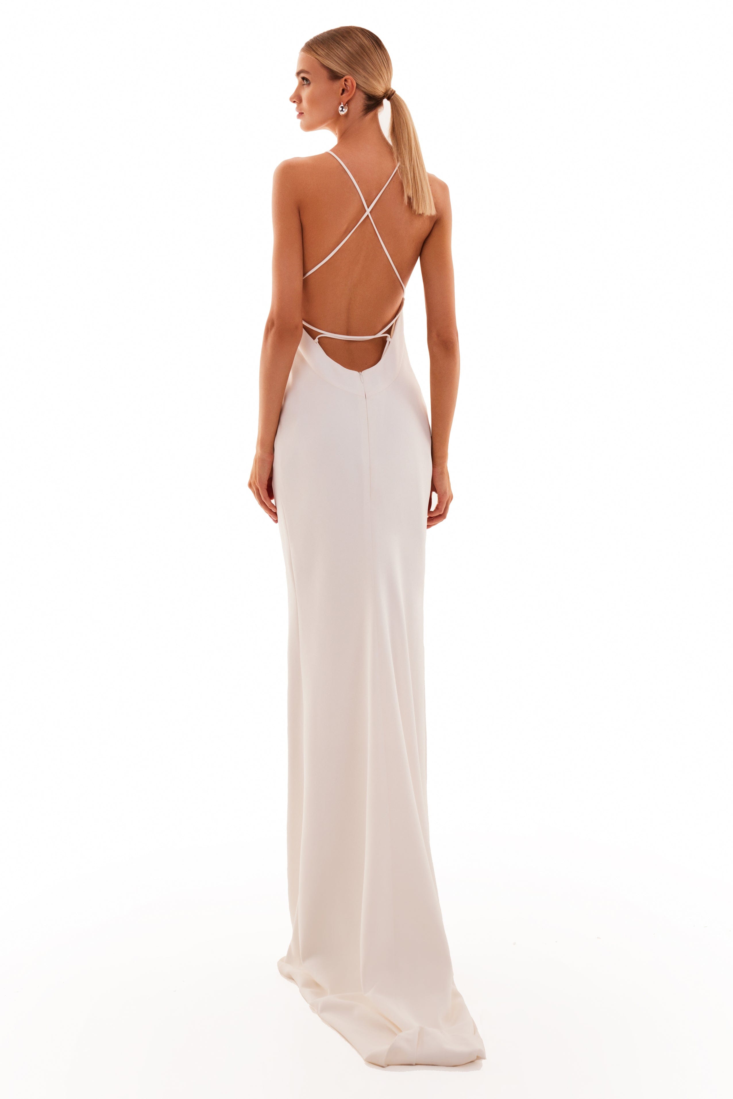 White halter top flowy maxi dress with gold necklace