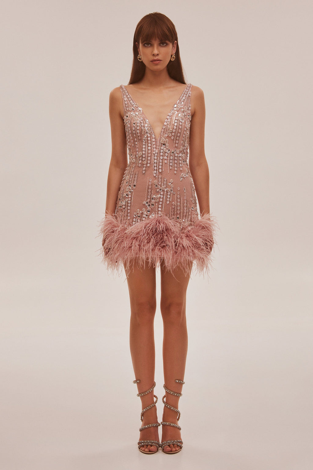Fabulous mini dress on straps adorned with crystals and feathers